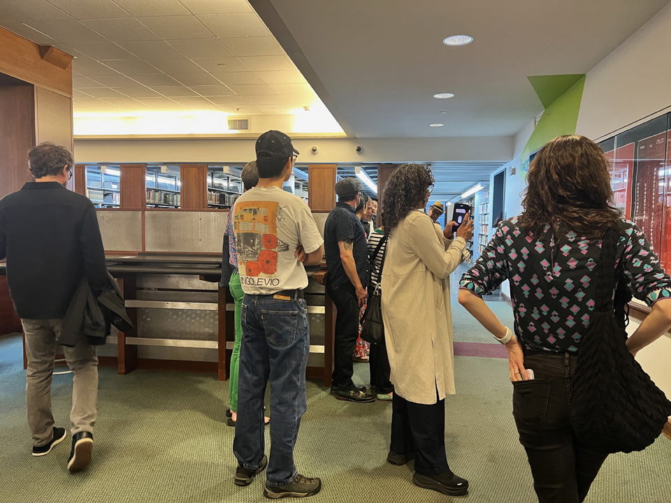 Guests viewing work in the New Media Artspace.