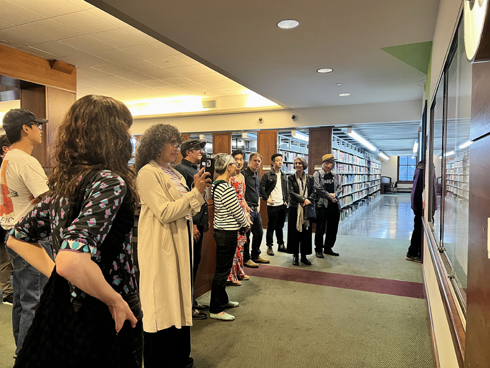 Guests viewing work in the New Media Artspace.